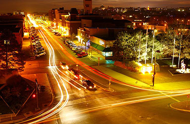 Night view of downtown Lawrence and city in background