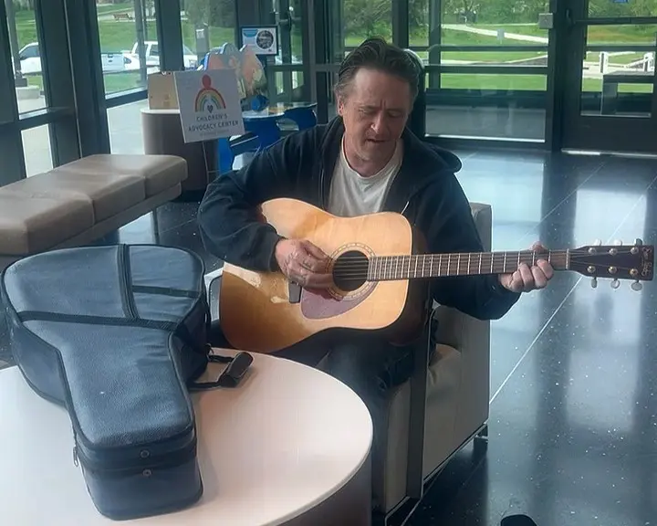 Jake playing returned guitar